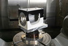  – The production specialists use low-cost, printed plastic fixtures to clamp a forearm structure. Thanks to the <em>hyper</em>MILL<sup>®</sup> BEST&nbsp;FIT function, the component can be fixed to the machine with these shells in an unaligned position.