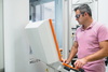  – Nick Katrov operating a CNC&nbsp;machine in his well-organized facility.